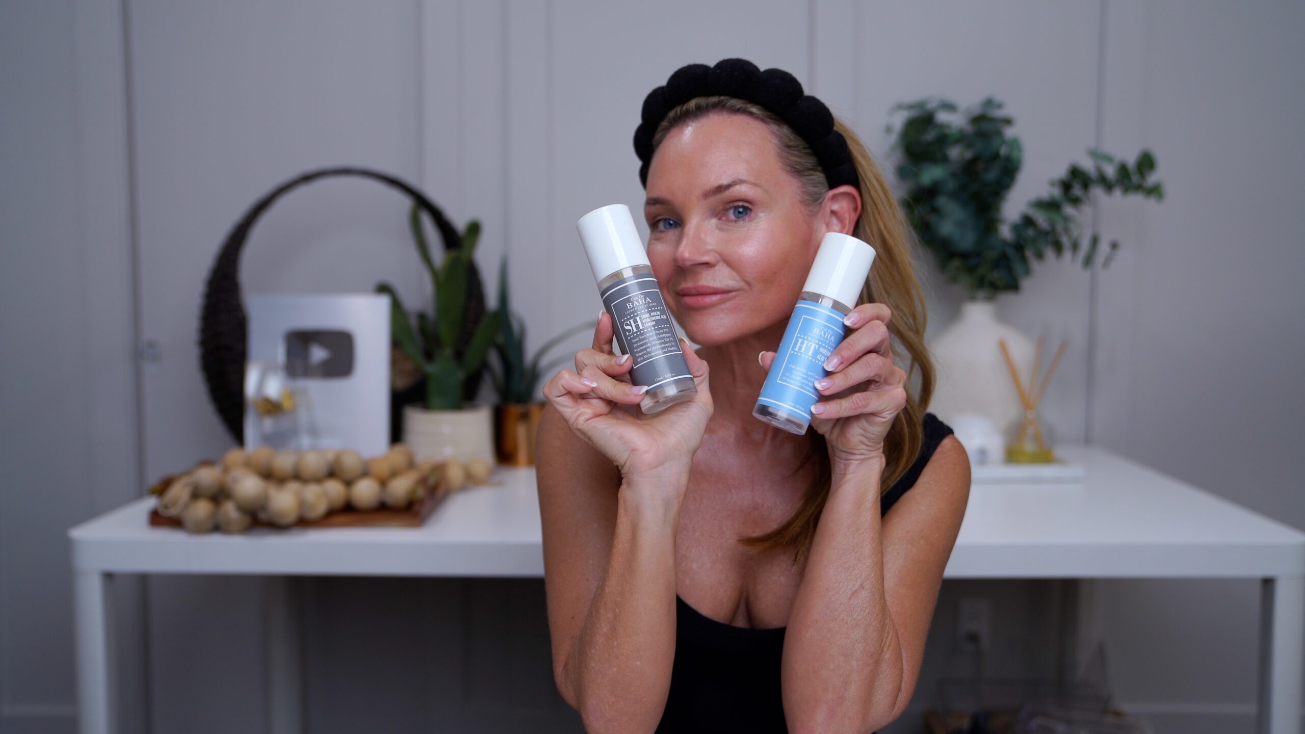 Kim holding two favorite skincare products