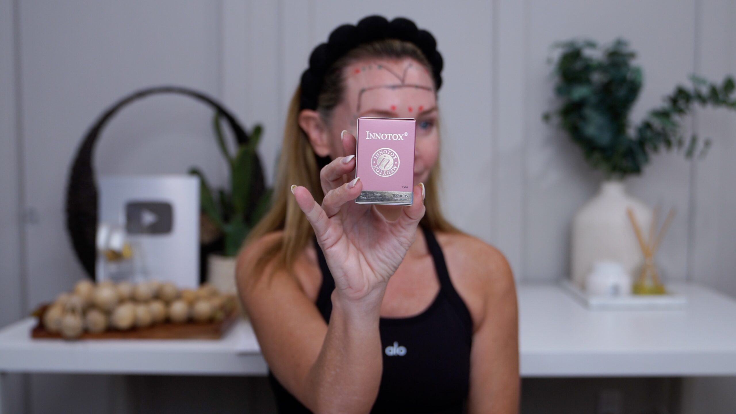 Kim Pratt holding the Innotox package shown in her Russian Tox video