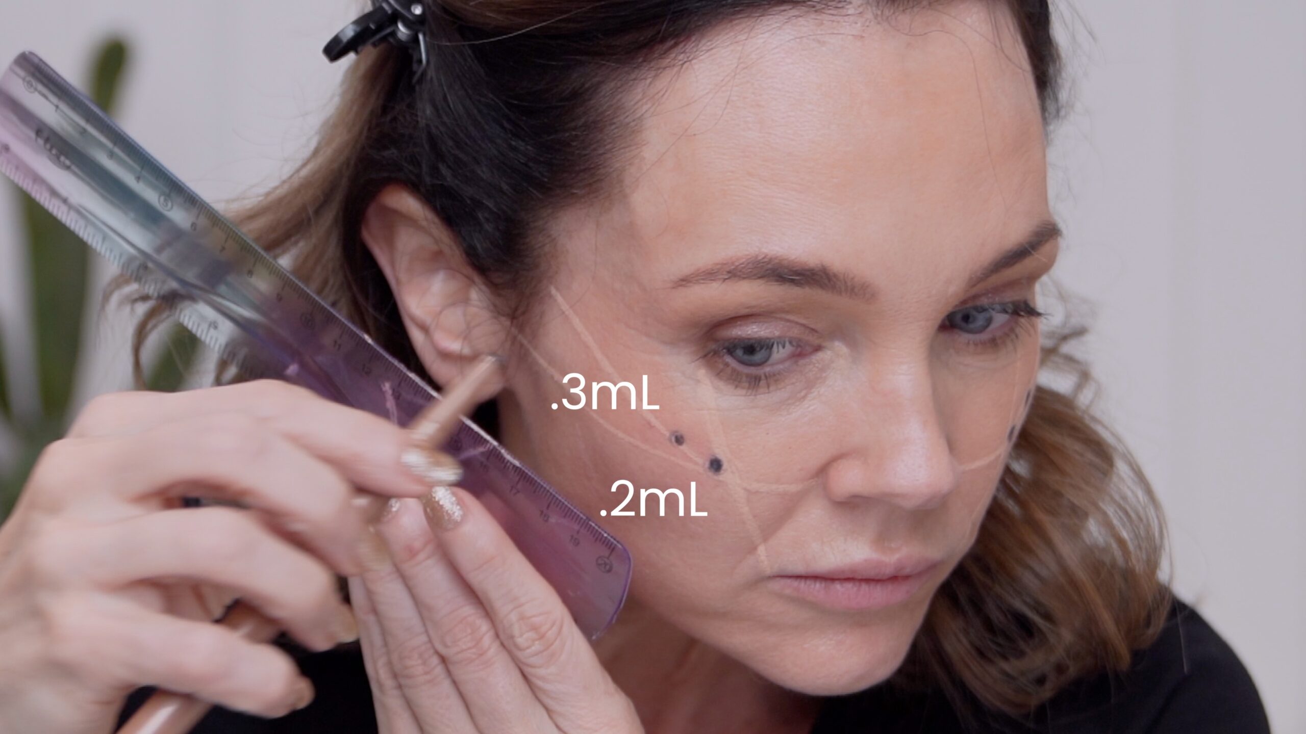 One-side view of Kimberly’s original cheek markings with product amounts labeled